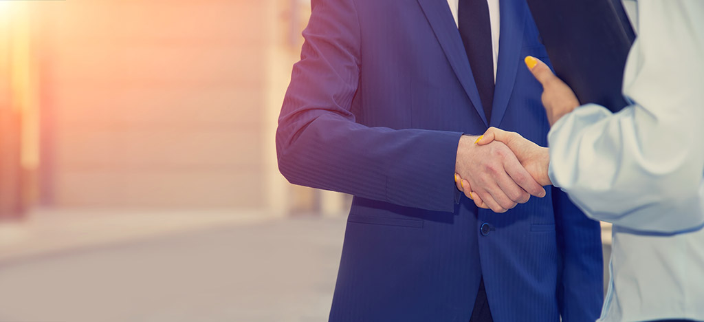 an image of two men shaking hands
